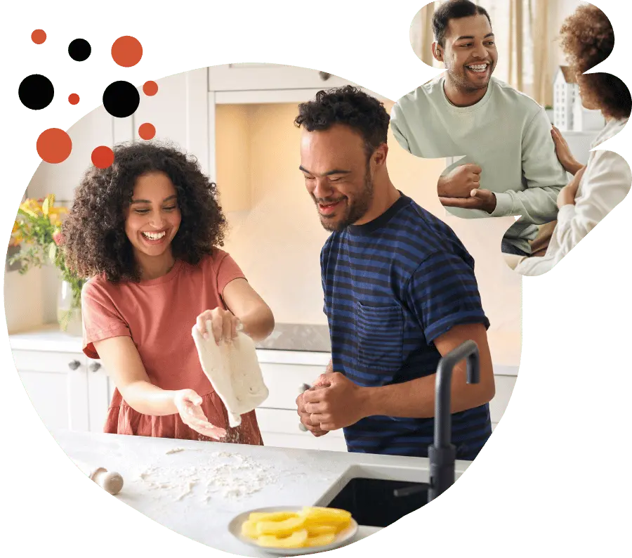 A disabled man and his support worker cooking in the kitchen and a disabled man talking to his support worker
